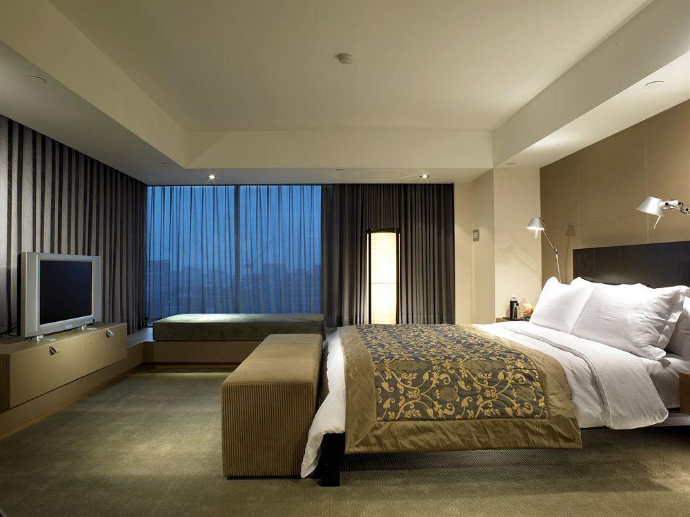 Hotel Regent Taipéi Habitación foto A bedroom in a hotel